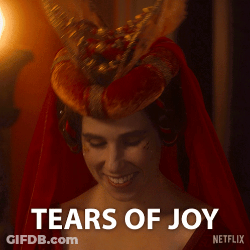 Woman In Red Dress Smiling Tears Of Joy GIF