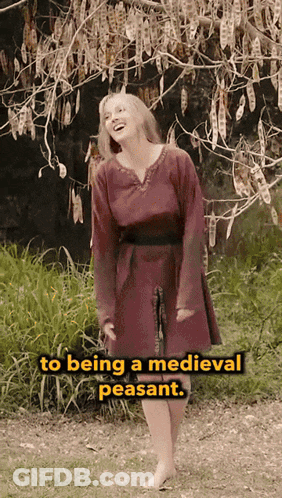 Woman In Red Dress Standing Before Tree Saying To Being A Medieval Peasant GIF