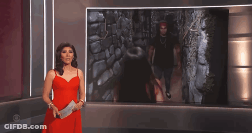 Woman In Red Dress Standing In Front Of Picture GIF
