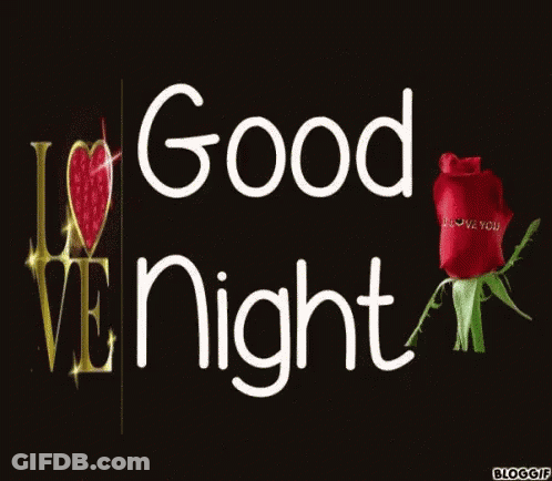 Woman In Red Dress Standing In Front Of Red Heart Saying Love GIF