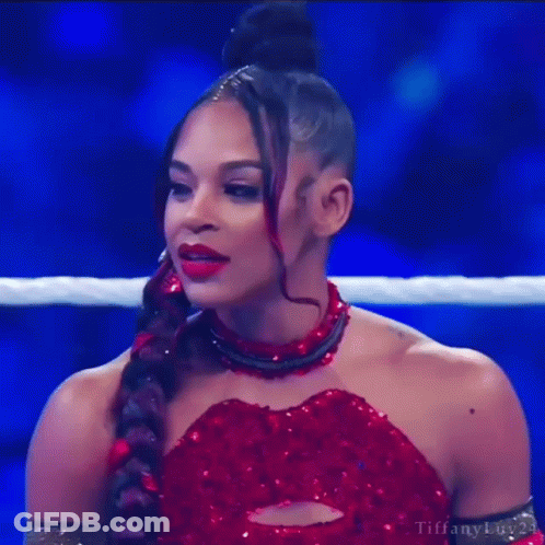 Woman In Red Dress Standing In Ring GIF
