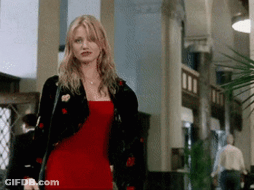 Woman In Red Dress Standing GIF