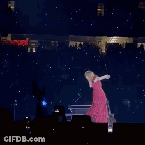 Woman In Red Dress Standing On Stage With Guitar GIF