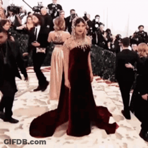 Woman In Red Dress Standing GIF