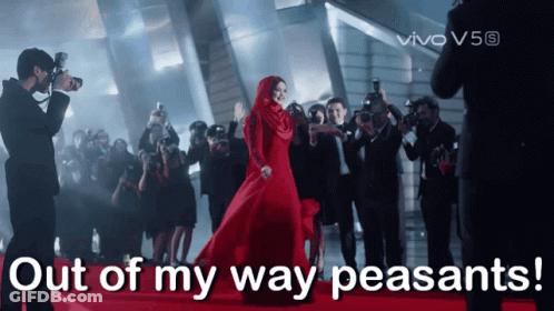 Woman In Red Dress Surrounded By Photographers Saying Out Of My Way Peasants GIF