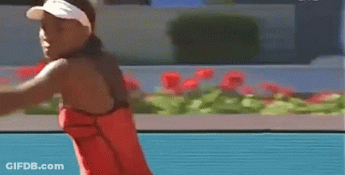 Woman In Red Dress Swinging Tennis Racquet GIF