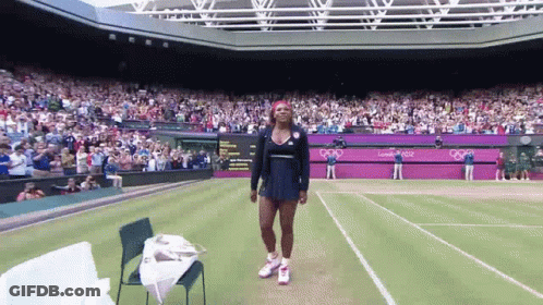 Woman In Red Dress Swinging Tennis Racquet GIF