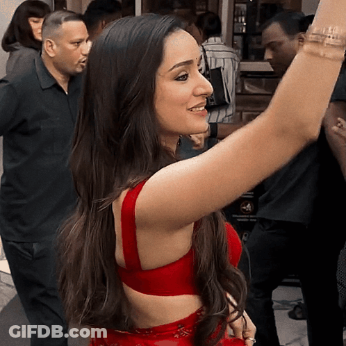 Woman In Red Dress Taking Selfie GIF
