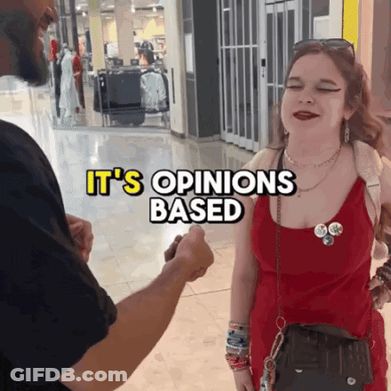 Woman In Red Dress Talking To Man In Black Shirt It's Opinions Based GIF