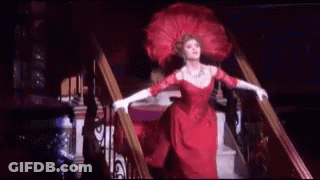Woman In Red Dress Walking Down Stairs GIF