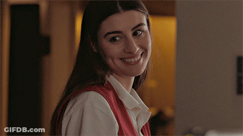 Woman In Red Dress Walking Down Stairs GIF