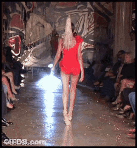 Woman In Red Dress Walking Runway GIF