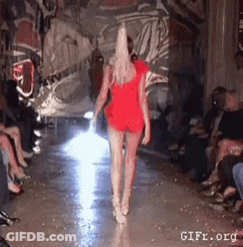 Woman In Red Dress Walking Runway GIF