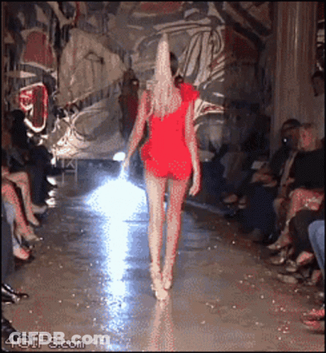 Woman In Red Dress Walking Runway GIF