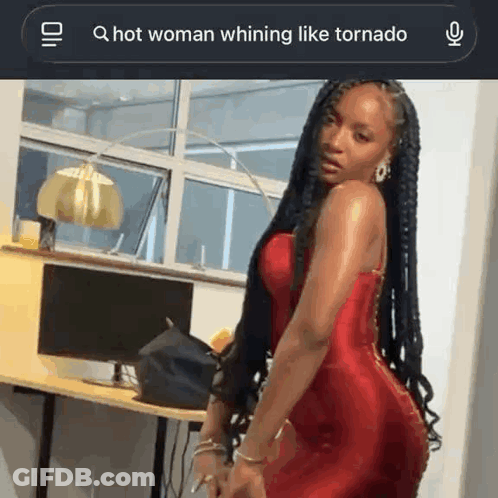 Woman In Red Dress Whining Like Tornado GIF