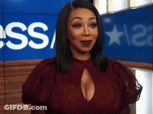 Woman In Red Dress With Plunging Neckline GIF