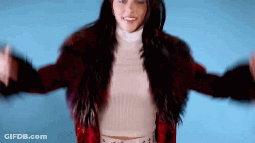 Woman In Red Fur Coat And White Turtleneck GIF