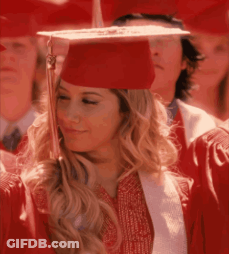 Woman In Red Graduation Cap And Gown Smiling GIF