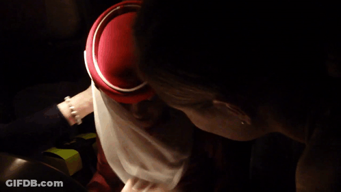Woman In Red Hat And White Scarf GIF
