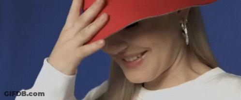 Woman In Red Hat Smiling Covering Face GIF
