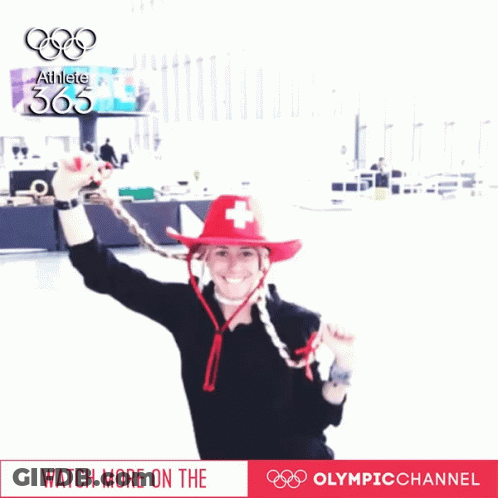 Woman In Red Hat With Swiss Cross And Athlete 365 Sign GIF