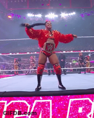 Woman In Red Holding Whip Wrestling Ring Raw GIF