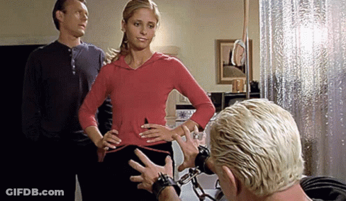 Woman In Red Hoodie Next To Man And Woman In Black GIF