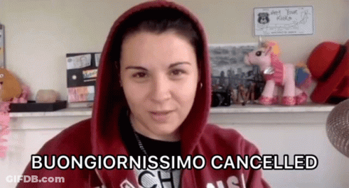 Woman In Red Hoodie Says Buongiornossimo Cancelled Beside Stuffed Unicorn GIF