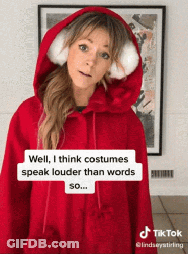 Woman In Red Hoodie Says Costumes Speak Louder GIF