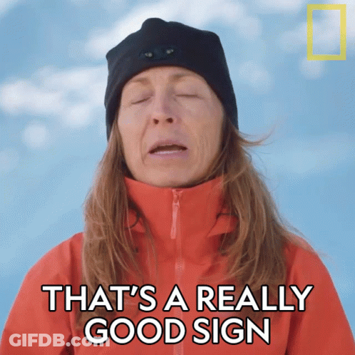 Woman In Red Jacket And Black Hat Says That's A Really Good Sign GIF