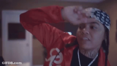 Woman In Red Jacket And Headband Dancing GIF