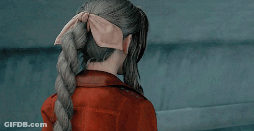 Woman In Red Jacket And Necklace GIF