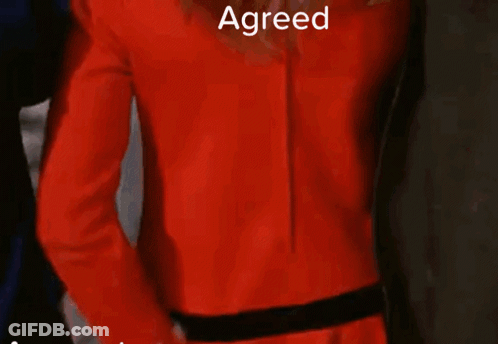 Woman In Red Jacket And White Gloves GIF