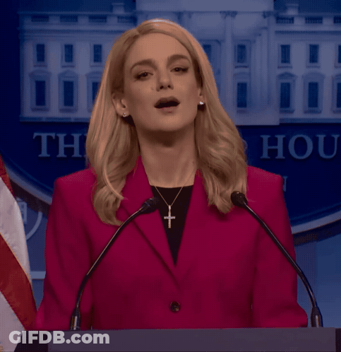Woman In Red Jacket At Podium Saying Thank GIF