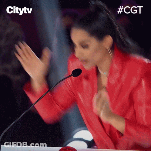 Woman In Red Jacket Dancing With Microphone And #Cgt GIF