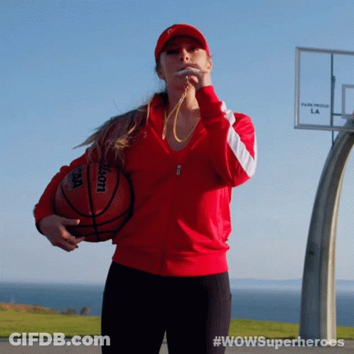 Woman In Red Jacket Holding Wilson Basketball And Blowing Whistle GIF