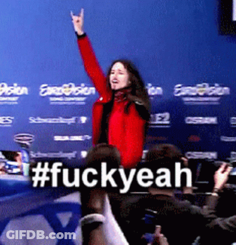 Woman In Red Jacket In Front Of Blue Wall #FuckYeah GIF