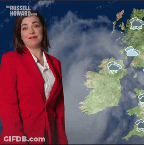 Woman In Red Jacket In Front Of Ireland Map GIF
