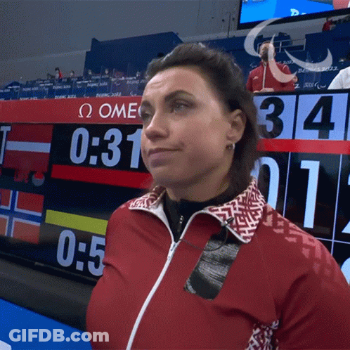 Woman In Red Jacket In Front Of Scoreboard Saying 0:31 GIF