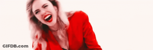 Woman In Red Jacket Laughing Looking Down GIF