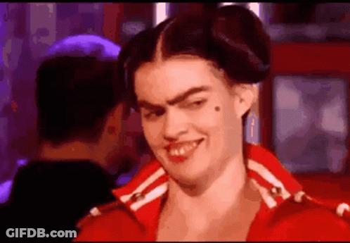 Woman In Red Jacket Making Funny Face GIF