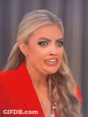 Woman In Red Jacket Making Funny Face GIF