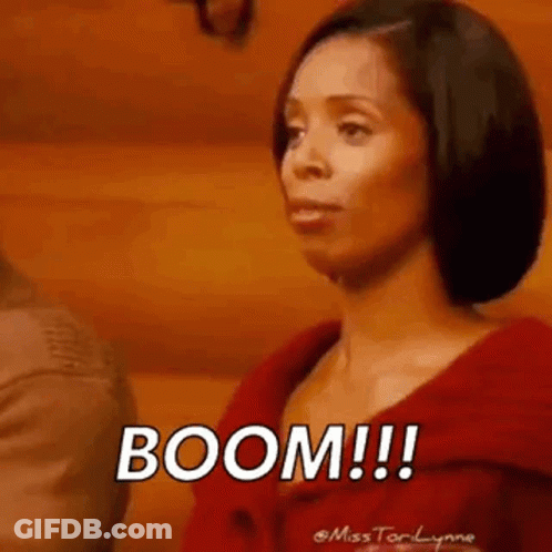 Woman In Red Jacket Saying Boom GIF