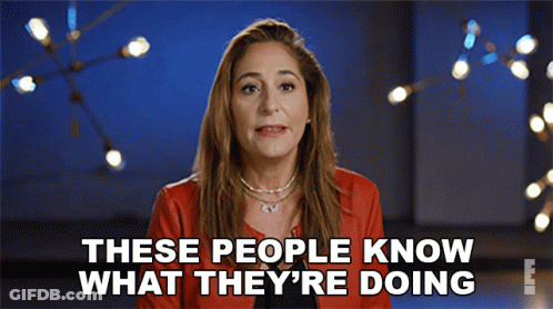 Woman In Red Jacket Saying These People Know What They're Doing GIF