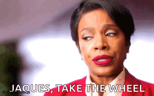 Woman In Red Jacket Says Jacques Take The Wheel GIF