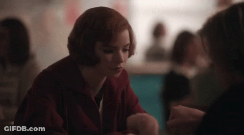 Woman In Red Jacket Sitting At Table With People GIF