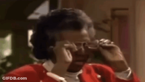 Woman In Red Jacket Talking On Cell Phone GIF