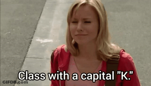 Woman In Red Jacket Walking With Eyes Closed GIF