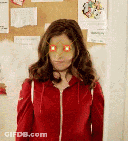 Woman In Red Jacket With Glasses GIF