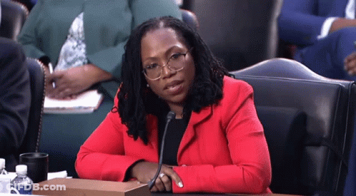 Woman In Red Jacket With Microphone GIF